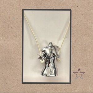 Zara silver body shaped necklace.